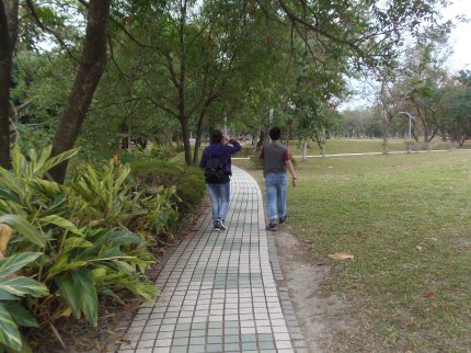 Eleni & Didier walking in Ta-An Forest Park.