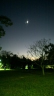 Moon and Venus, seen from open ground in Da-An Forest Park during night.