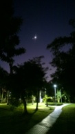 Moon and Venus, seen from open ground in Da-An Forest Park during night.